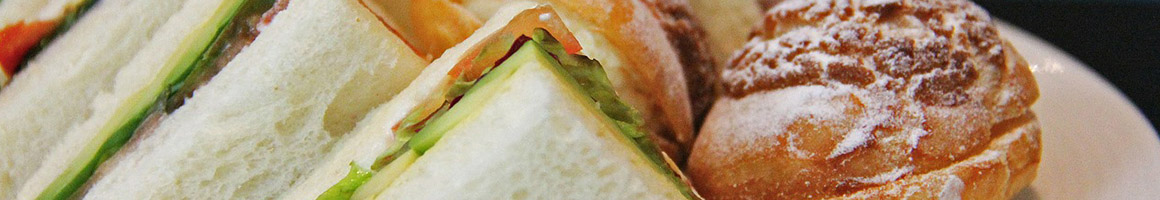Eating Deli Sandwich at Pickles-A Deli restaurant in Middletown, RI.